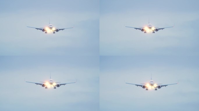 在蓝天上飞行的喷气式客机。飞行员在雾天光线不好的情况下开了灯。飞机抵达机场并在黄昏降落