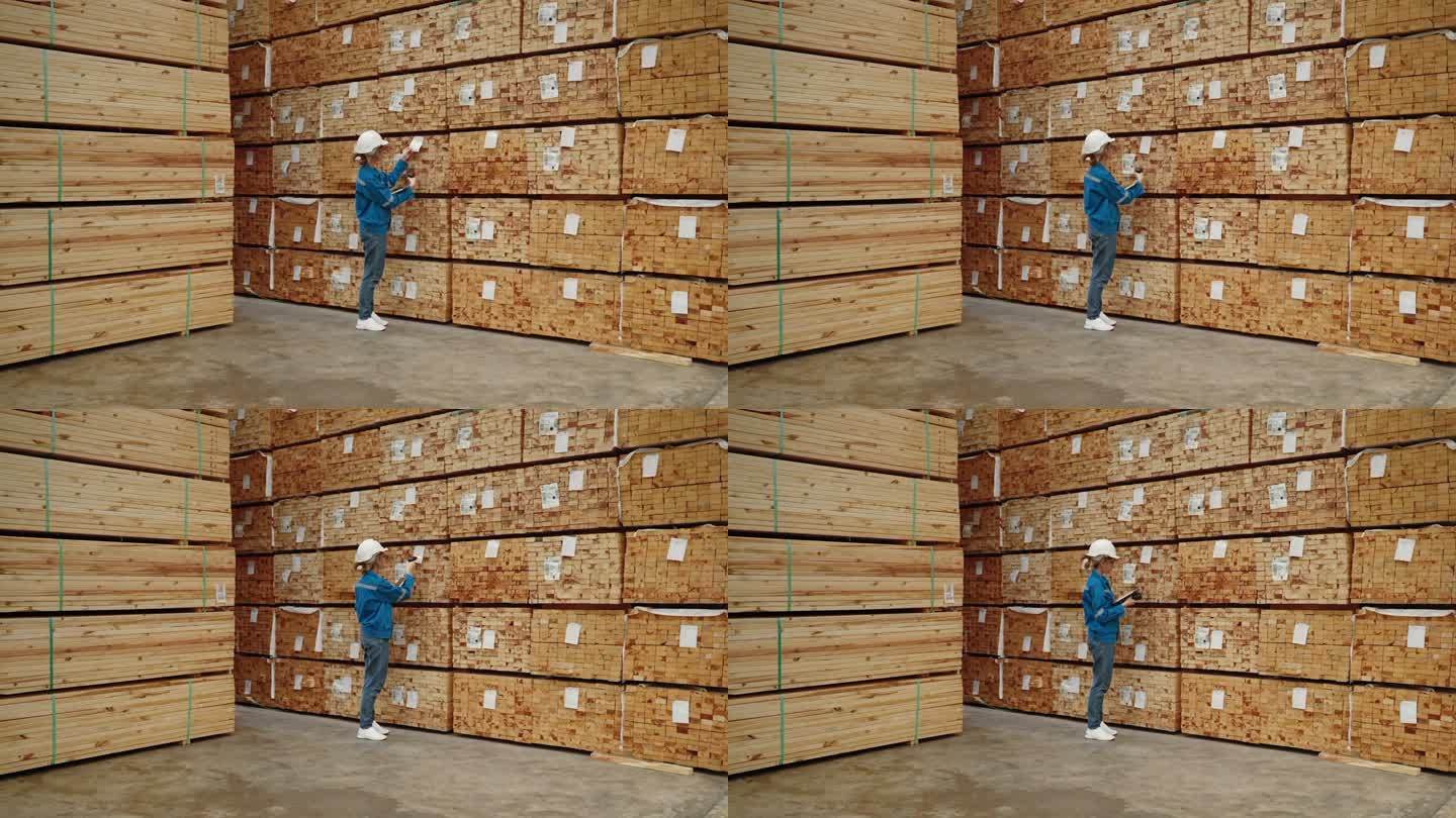 工人或检验员正在检查托盘木工厂货物的质量和数量。