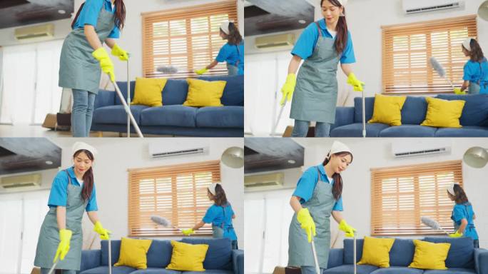 亚洲女佣或管家团队帮助打扫客厅，一个人用扫帚清洁地板，另一个人用鸡毛掸子清洁窗户。