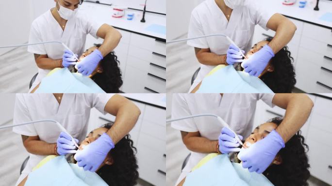 牙医用牙钻治疗病人牙齿的特写