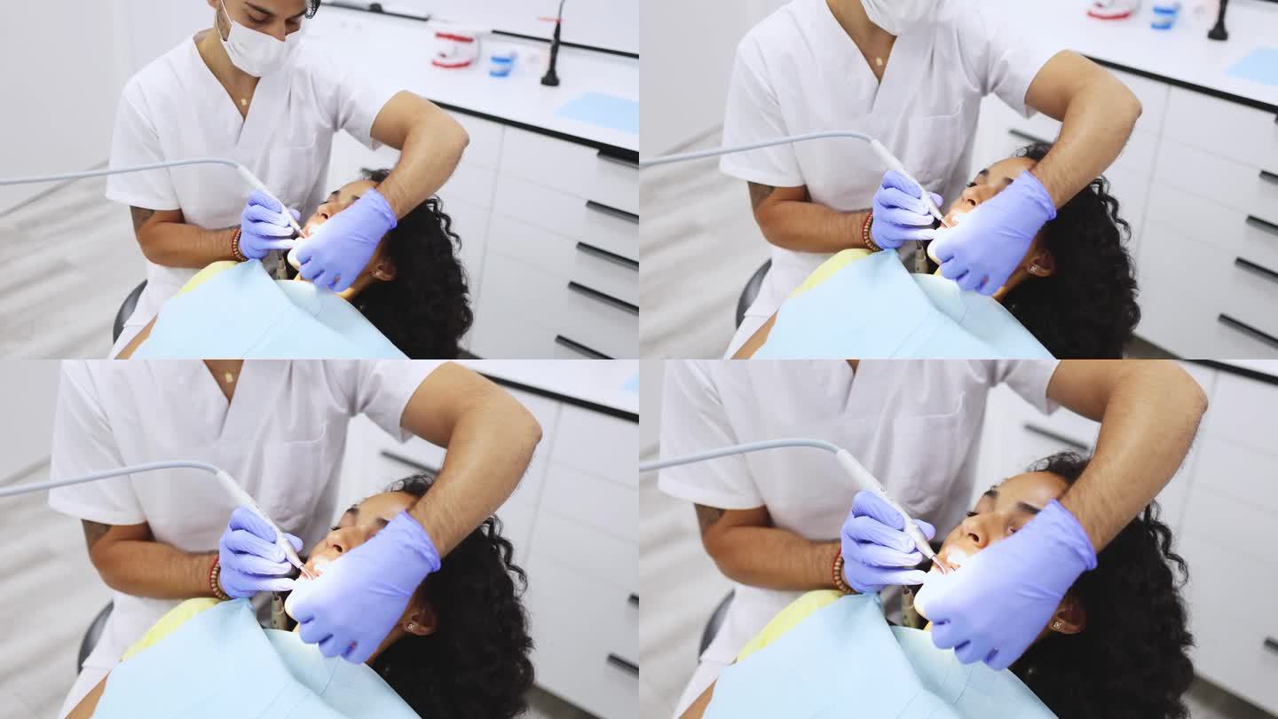 牙医用牙钻治疗病人牙齿的特写