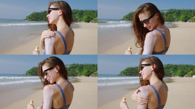 美丽的白人女孩在阳光明媚的夏日在海上涂抹防水防晒霜。在热带海滩上，一名女子在皮肤上涂上防水防晒剂，以