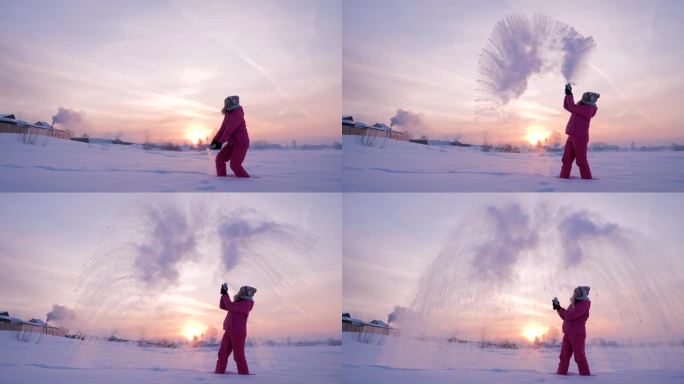 在一个美丽的冬日，夕阳西下，一个快乐的女孩正在寒冷的空气中泼热水。慢镜头