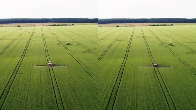 无人机空中交响乐:拖拉机在日光下喷洒绿色的田野，在农业进步的挂毯上