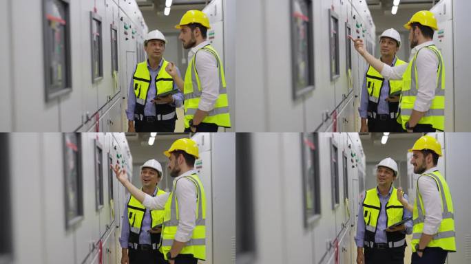 4K男工程师在工厂服务器电控室团队工作。