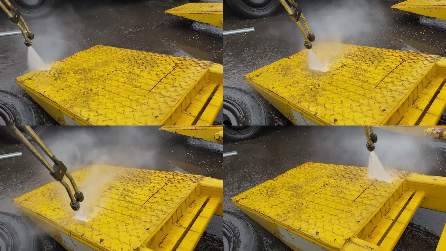 黄色卡车施工设备的高压清洗