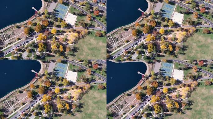 在色彩缤纷的秋季，一架4K无人机在科罗拉多州丹佛市的华盛顿公园和网球场、弗农山花园和格拉斯米尔湖上空