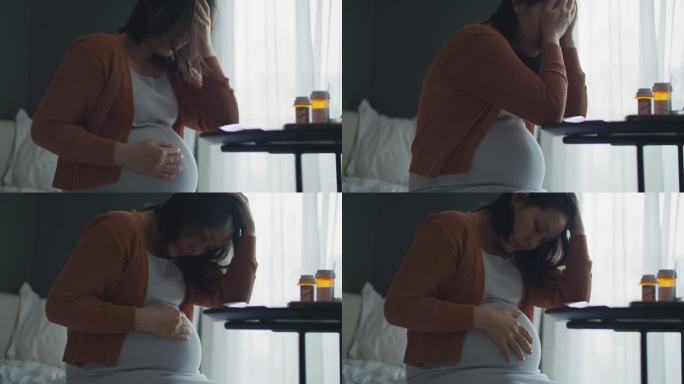 孕妇在家头痛孕妇抚摸肚子胎儿安抚孕妇肚子