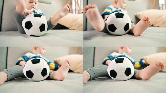 小男孩坐在家里的沙发上玩柔软的足球玩具