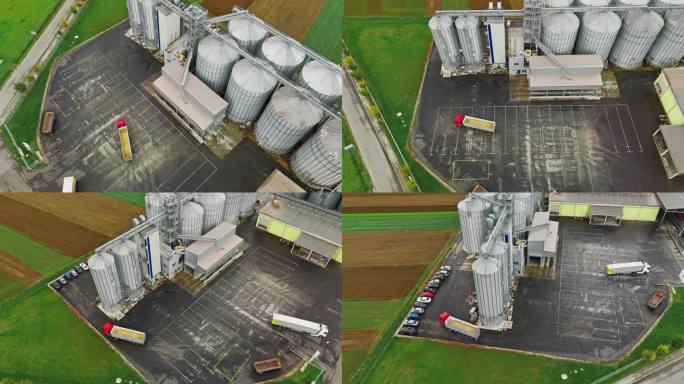 无人机拍摄到满载谷物的拖车在农场的筒仓间行驶