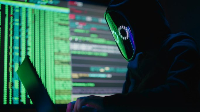 戴面具的匿名黑客侵入数据服务器，用病毒感染系统