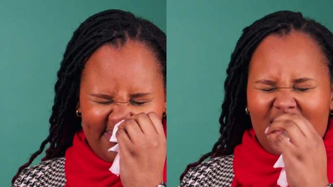 垂直视频显示一名非洲妇女感到恶心，打喷嚏和揉鼻子