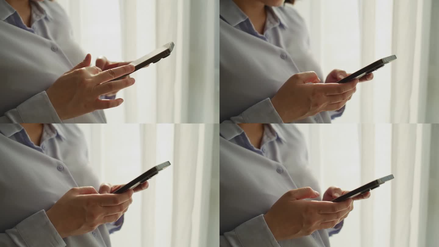一个女人的手在操作智能手机