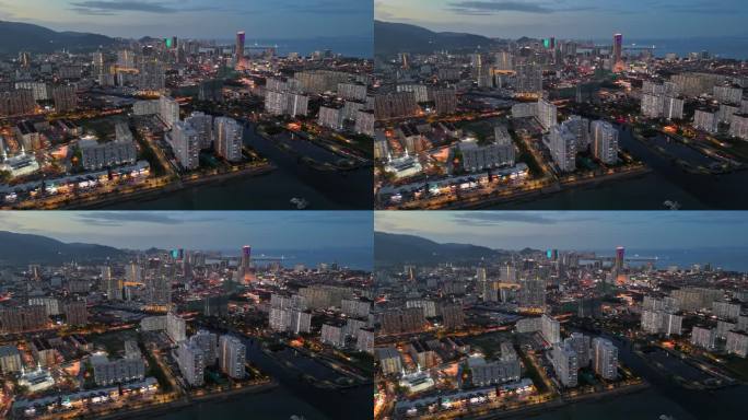 马来西亚槟城乔治城的航拍夜景。槟城乔治城的河堤和市中心有摩天大楼和日落后的照明