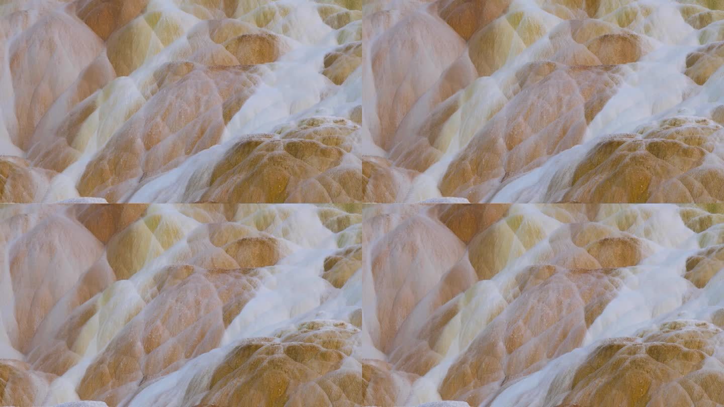 黄石国家公园猛犸温泉的彩色石灰华泉的抽象图案和泡沫