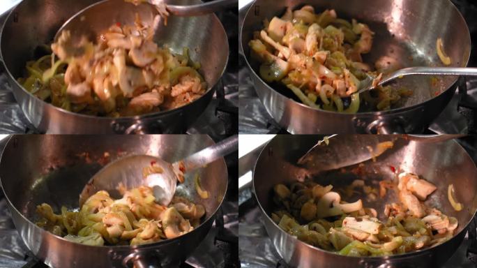 用平底锅煎洋葱炒蘑菇。切片