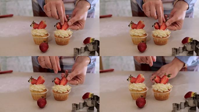 一位女糕点师用水果装饰纸杯蛋糕，草莓纸杯蛋糕，自制烘焙，小生意，环保生产，无麸质产品，无糖，健康饮食