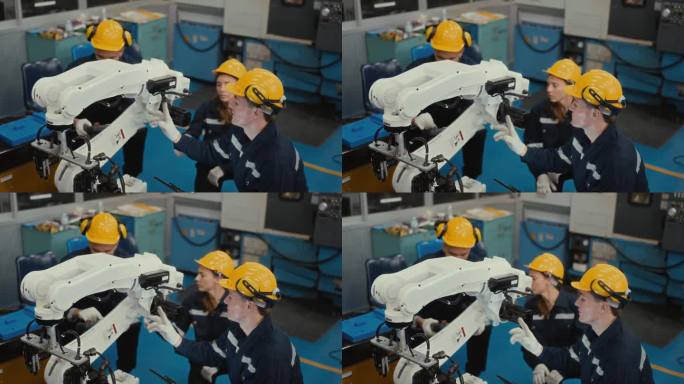 高效的团队合作:维修工程师在工厂环境中修理机械臂。