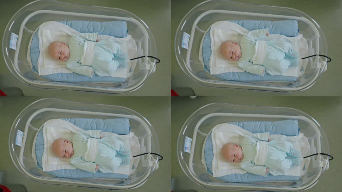 医管局新开始:介绍在产科病房的婴儿床里的新生男婴