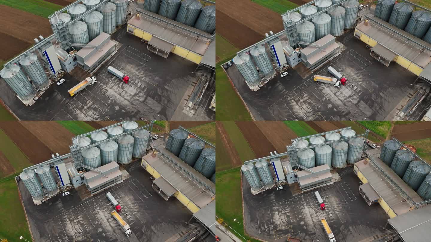 无人机拍摄的装满谷物的拖车在仓库停车场行驶