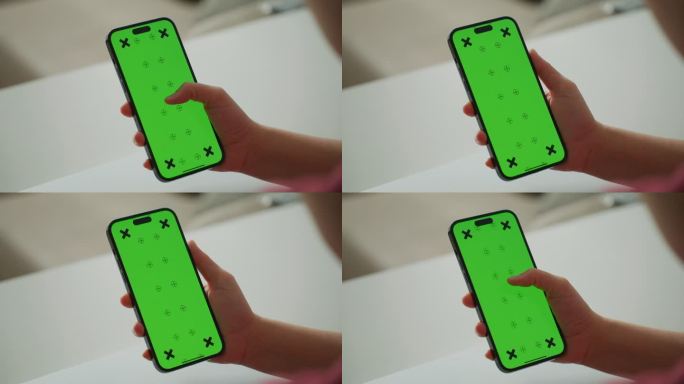 女性手持智能手机的绿色屏幕显示