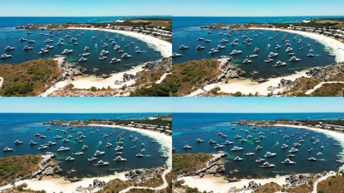 在一个阳光明媚的日子里，一架无人机在西澳大利亚罗特尼斯岛的乔迪湾上空与许多游艇在一起