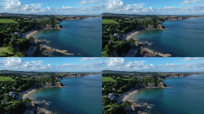 4K:英国康沃尔郡海岸线的空中无人机视频。沿着圣奥斯特尔悬崖飞行。库存视频剪辑素材