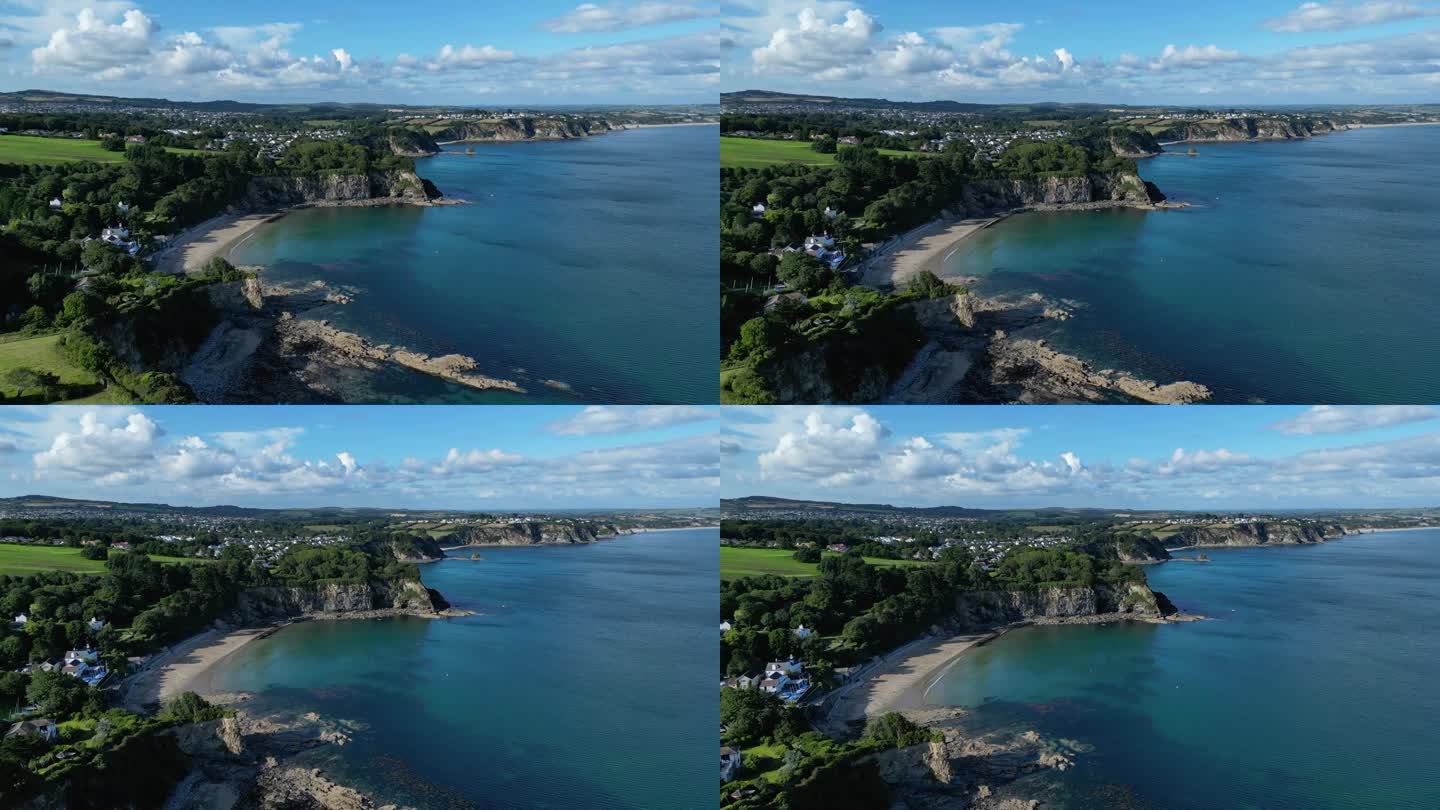 4K:英国康沃尔郡海岸线的空中无人机视频。沿着圣奥斯特尔悬崖飞行。库存视频剪辑素材