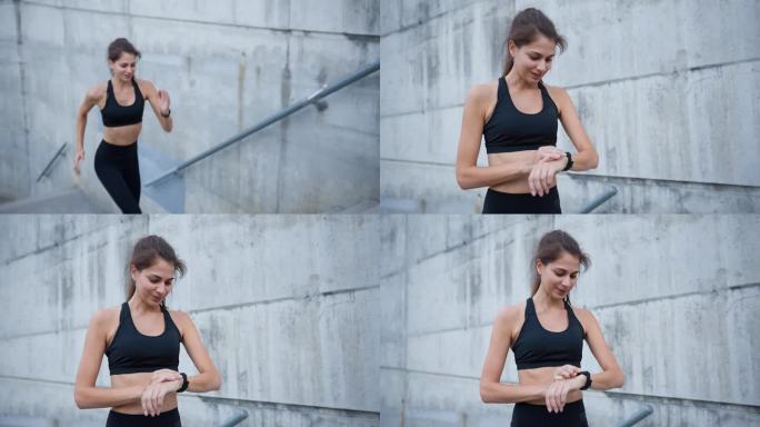 健康的女性跑步者在跑完城市楼梯后检查智能手表上的脉搏痕迹