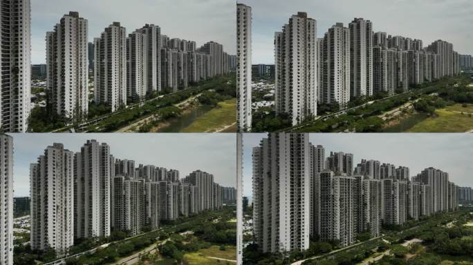 单调的灰色公寓楼在郊区贫民窟鬼城，巨大的中国投资的大规模公寓住房项目在森林城市马来西亚柔佛