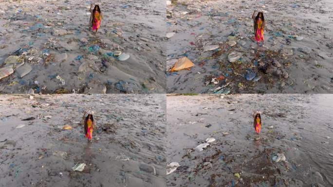 航拍缩小。在塞内加尔的达喀尔，一名卖鱼的黑人妇女头上顶着一个篮子，穿过鱼市海边可怕的塑料污染