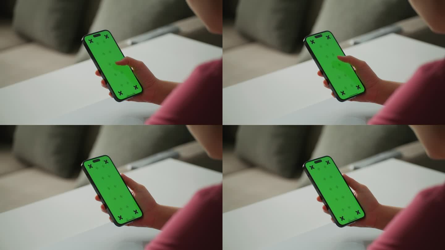 女性手持智能手机的绿色屏幕显示