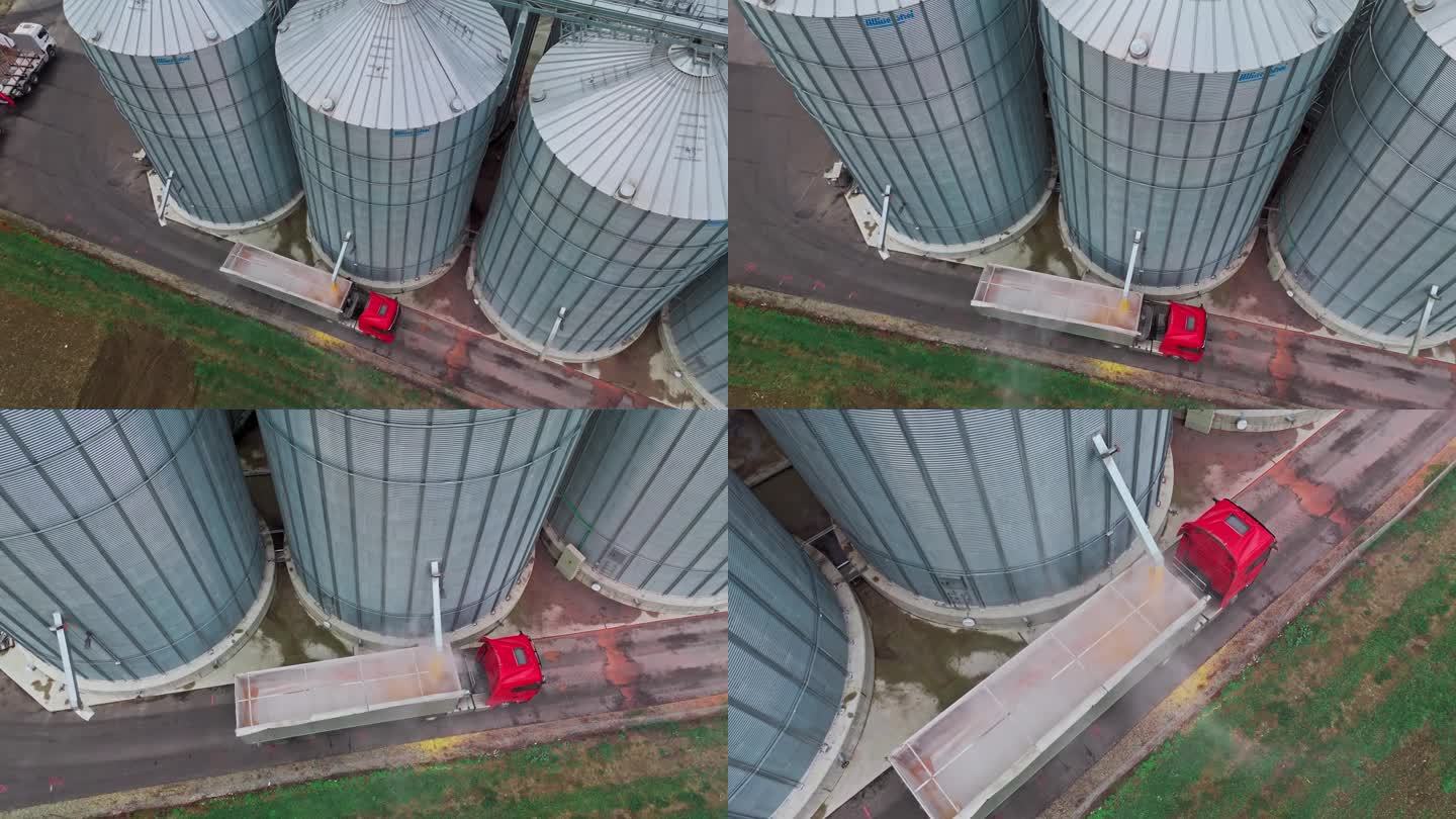 无人机在农场拍摄筒仓填充拖车卡车