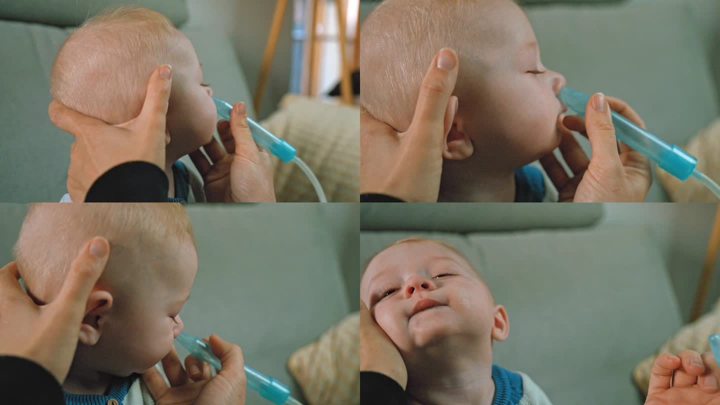妈妈用吸鼻器轻轻地清理宝宝的鼻子