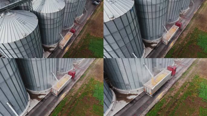 慢动作无人机拍摄农村农场的粮仓装满拖车卡车