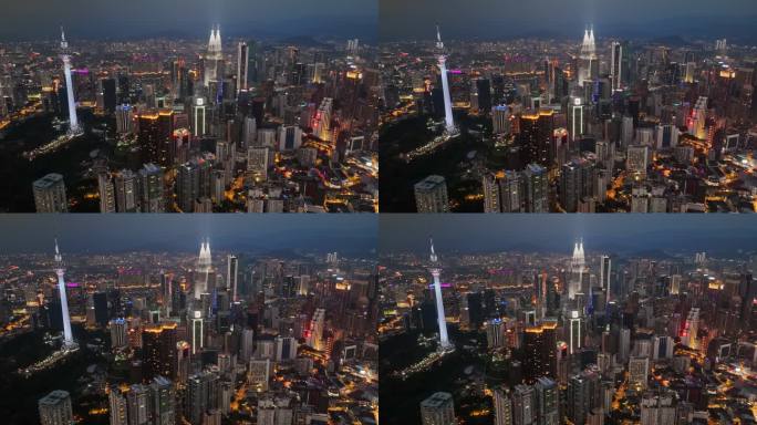 吉隆坡市中心夜间HDR航拍，摩天大楼和电视塔灯火通明。日落后飞越吉隆坡城市的灯光