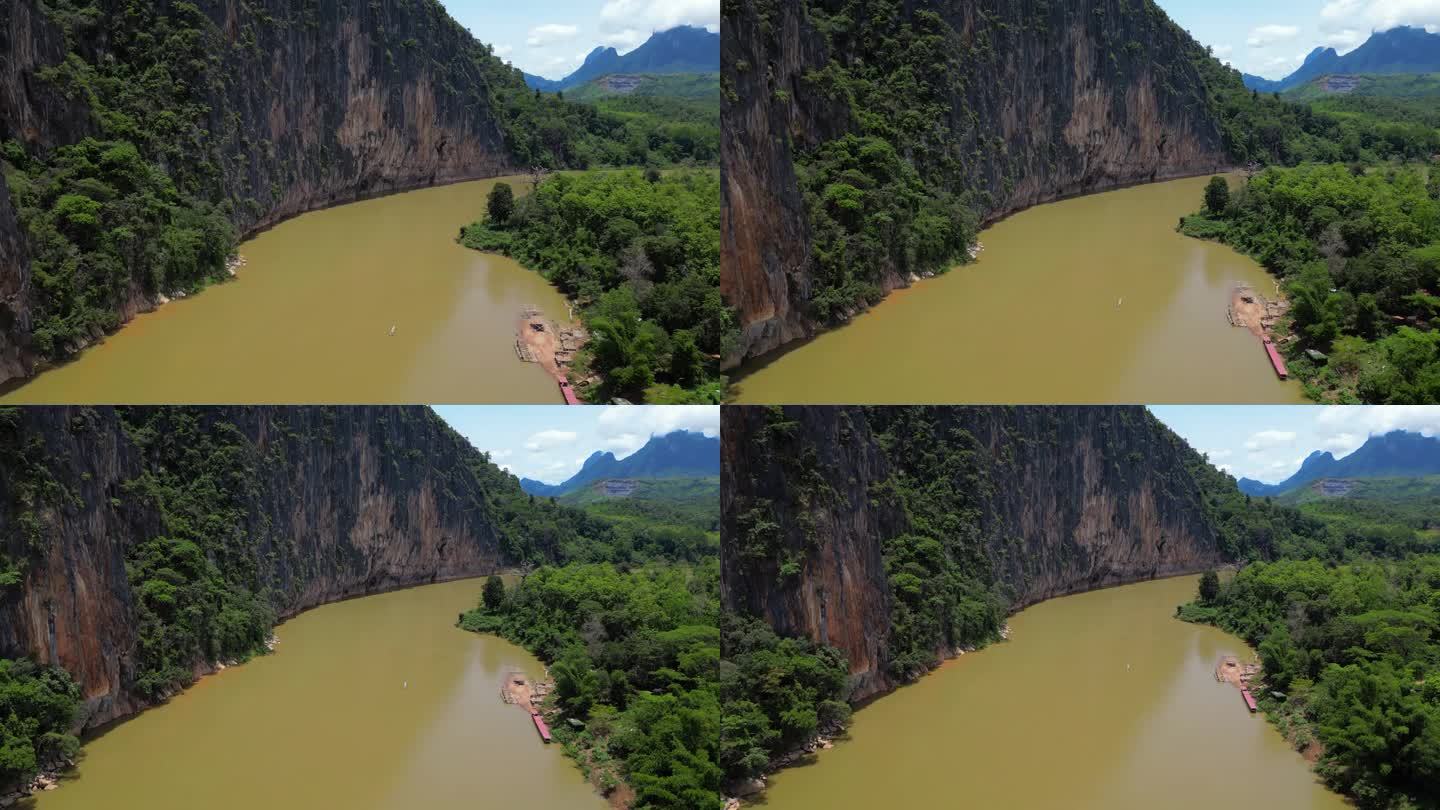 湄公河在老挝琅勃拉邦丛林周围弯曲高角度无人机撤退