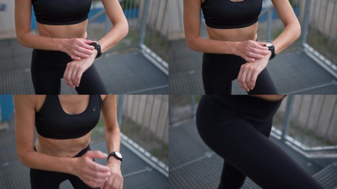 女子跑步者在激活智能手表上的秒表应用程序后开始跑步