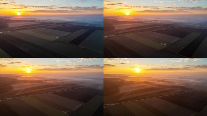 无人机拍摄雾和日出在田园诗般的乡村景观