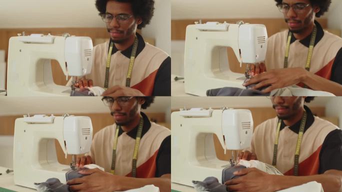 黑人专家在工作室里摆弄缝纫机