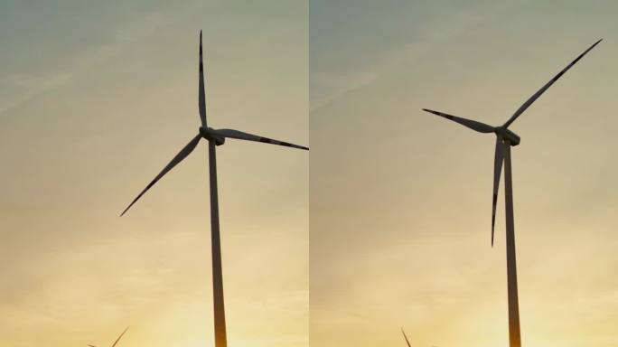 空中向日葵和可再生能源:宁静的日落无人机镜头雄伟的风力涡轮机屹立在金色的承诺领域