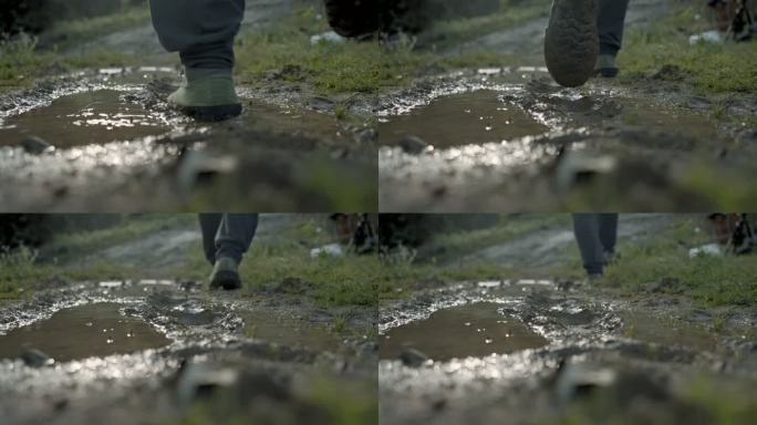 穿着解放鞋在泥泞的道上行走