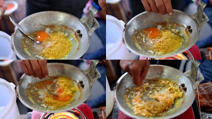 将鸭蛋打碎，放入装满米饭的煎锅中，制作典型的贝塔维蛋皮