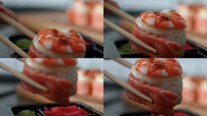 日本食物，有米饭、红生鱼、奶油奶酪、鲑鱼、虾、鳄梨和海苔。桌上摆着开胃的寿司卷。寿司厨师提供的美味又