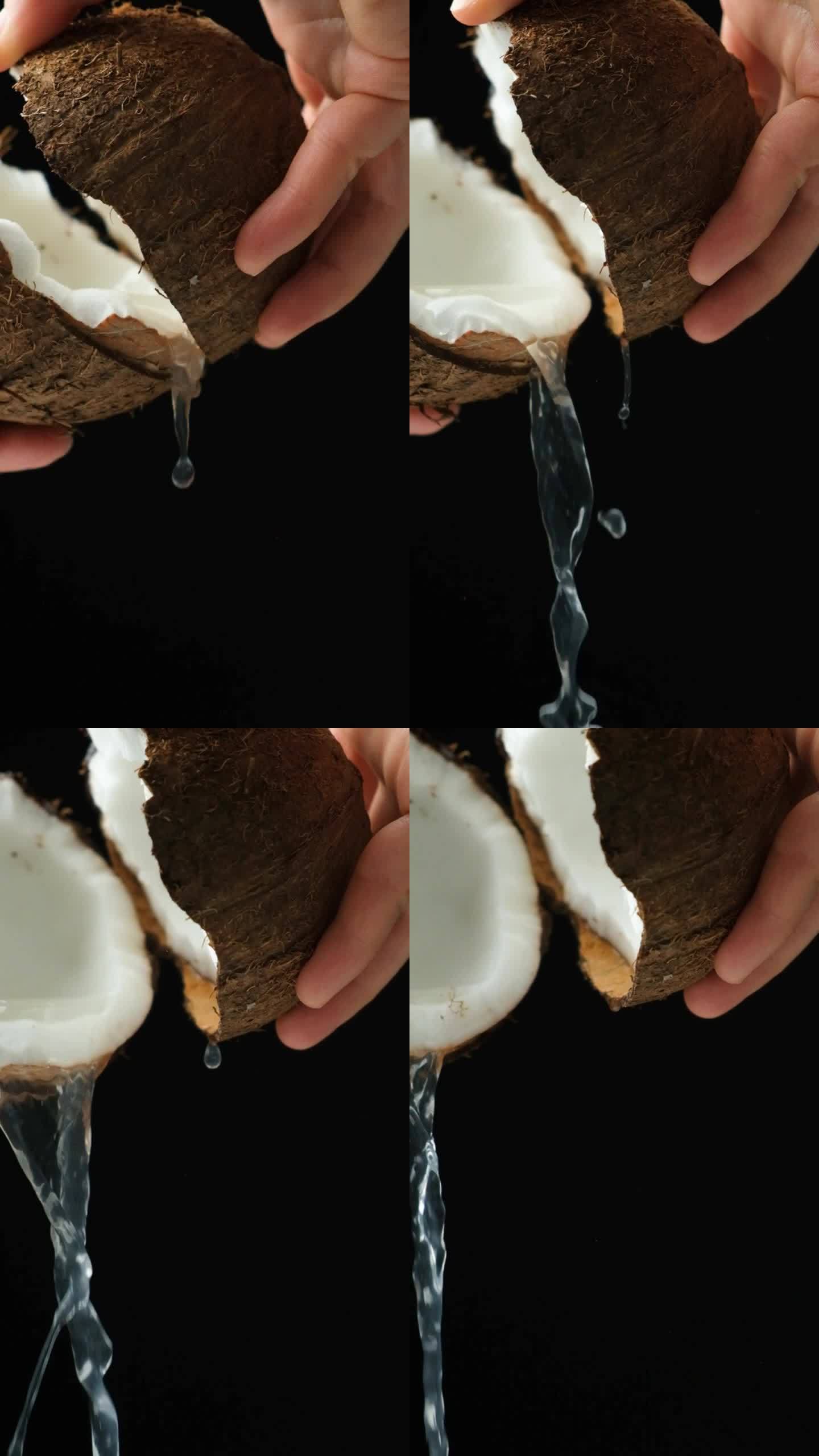 一个人打开椰子，椰子汁倒在黑色的背景上，垂直的慢动作
