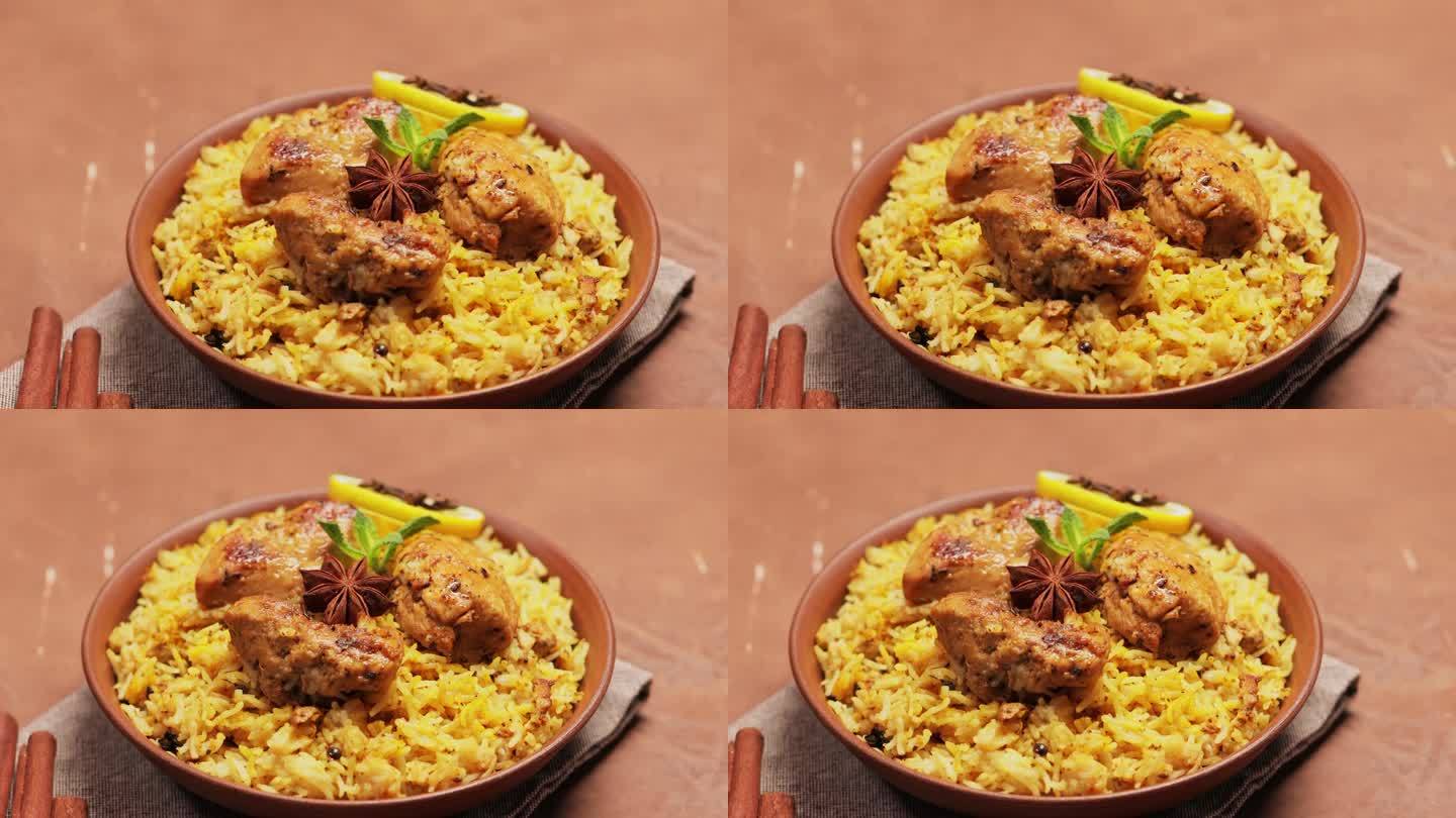 印度菜鸡肉印度香饭与印度香米在棕色背景，平移相机拍摄