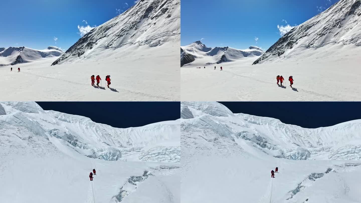 团队徒步励志攀登雪山奋斗登顶 前行背影