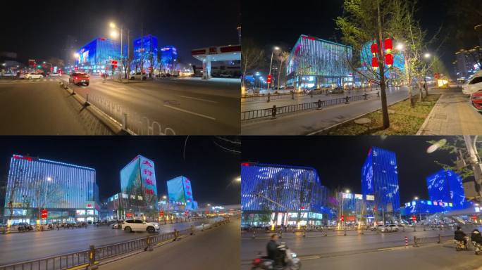 移动延时摄影霓虹灯下的城市购物广场