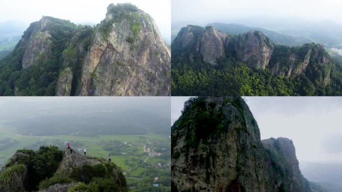 一群登山人山顶欢呼笔架山皖南山区