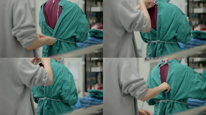手术室护士在穿手术衣